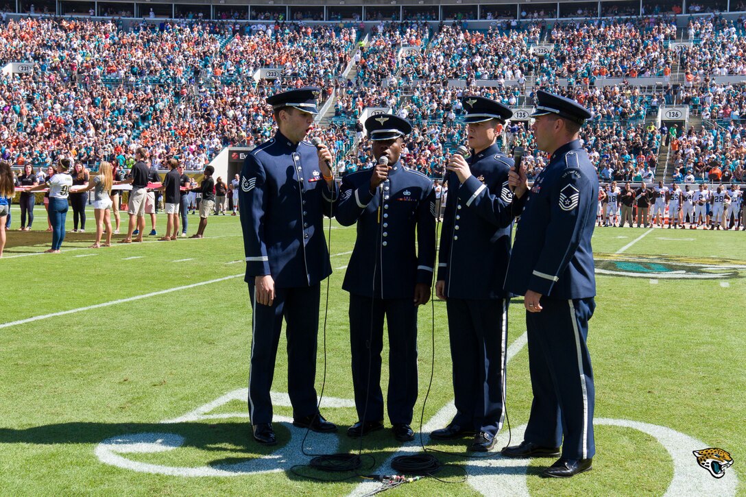 The United States Air Force Men’s Quartet performed the National Anthem on the fifty yard line at the Jacksonville Jaguar’s game at EverBank Field.  This performance was a part of the Concert Band and Singing Sergeants' Fall Tour 2014 which took them through parts of Alabama, Florida, and Georgia. (U.S. Air Force Photo by Senior Master Sgt Bob Kamholz/released)