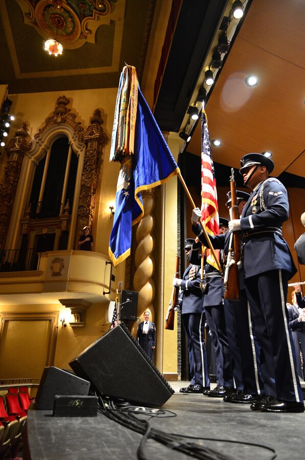 Members of the United States Air Force Honor Guard present the colors prior to a concert at the Saenger Theater in Pensacola, Florida.  These Honor Guardsmen travelled with the band on their 2014 Fall Tour through parts of Alabama, Florida, and Georgia. (U.S. Air Force Photo by Senior Master Sgt. Bob Kamholz/released)
