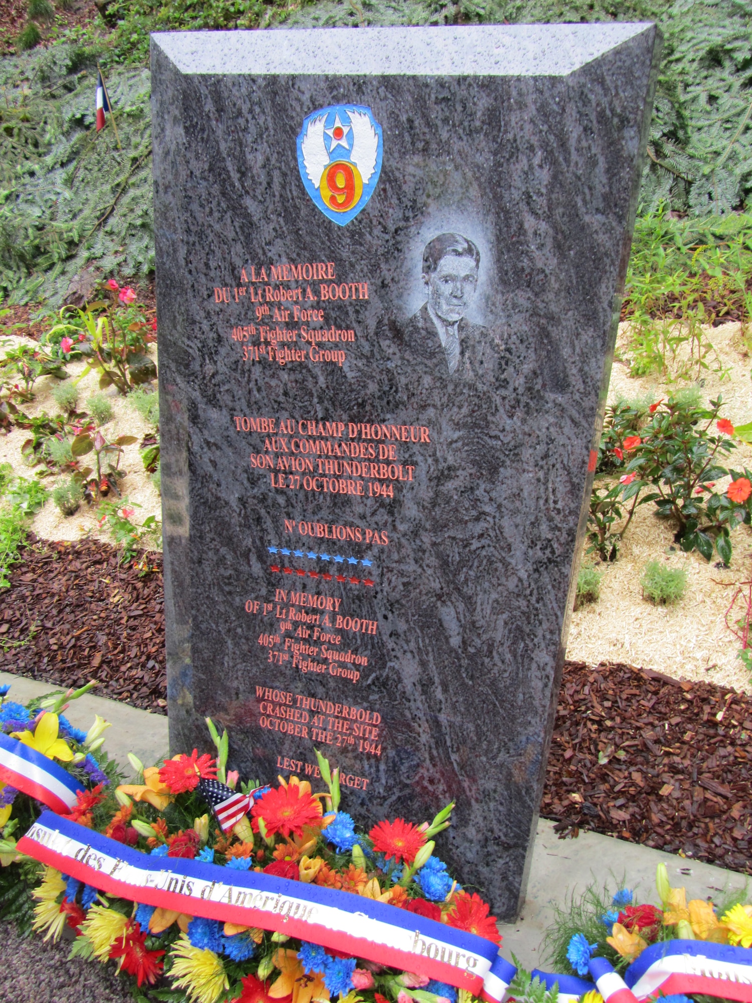 The stone memorial to 1st Lt. Robert A. Booth, located outside the town of Le Val d’Ajol, France, was dedicated by grateful French citizens and American diplomatic and military personnel on July 15, 2012. Source: (US Consulate General, Strasbourg, France, US State Department) 

