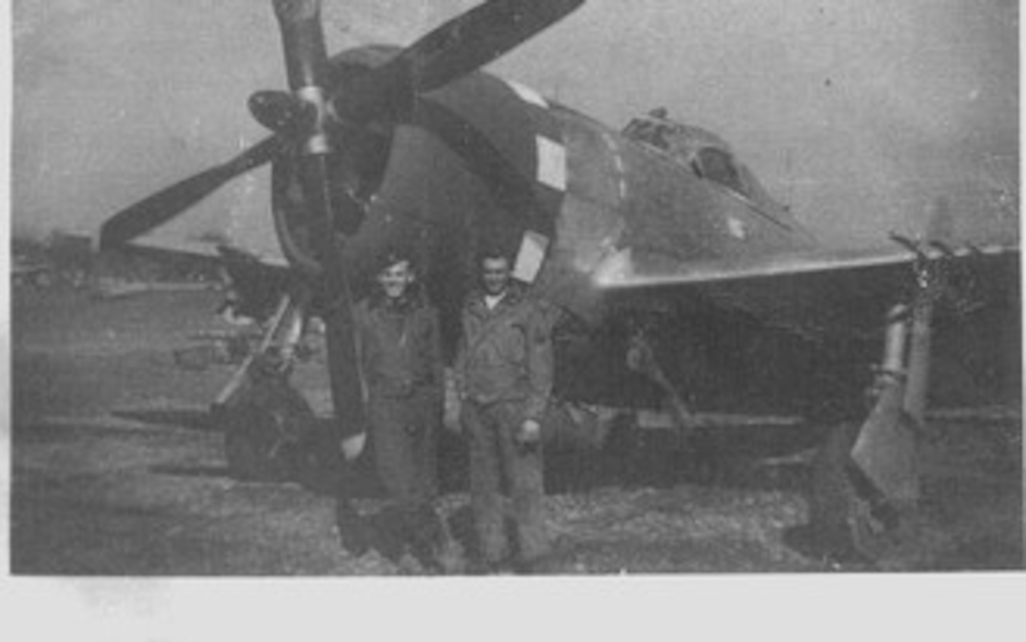 Republic P-47D Thunderbolt fighter-bomber of the 405th Fighter Squadron, flown by 1st Lt. Robert L. Griffith, at left, with an unidentified NCO, likely the crew chief of the aircraft.  The effort to help the Lost Battalion was one of Lt Griffith’s early missions, and he was concerned more about the nasty weather than he was about the enemy. Source:  (Courtesy Mr. Jürg Herzig, Stand Where They Fought website, used with permission)   
