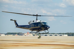 The first of three UH-1N helicopters, previously owned by the U.S. Marine Corps, lands at Joint Base Andrews, Md., Oct. 21, 2014. The helicopters will bring increased mission capability for the 11th Wing to support its critical missions. (U.S. Air Force photo/Staff Sgt. Robert Cloys)