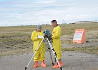 Staff Sgt. Arlen Martin, left, and Senior Airman Johnathan Sabat-Figueroa, both from the 341st Medical Operation Squadron, collect air quality samples during an exercise held at Malmstrom Air Force Base, Mont. Oct. 27, 2014 as part of Global Thunder 15.  Global Thunder is a U.S. Strategic Command annual field training and battle staff exercise designed to exercise all mission areas with primary emphasis on nuclear command, control and communications. This field training and battle staff exercise provides training opportunities for components, task forces, units, and command posts to deter and, if necessary, defeat a military attack against the United States and to employ forces as directed by the president.  (U.S. Air Force photo/Christy Mason)