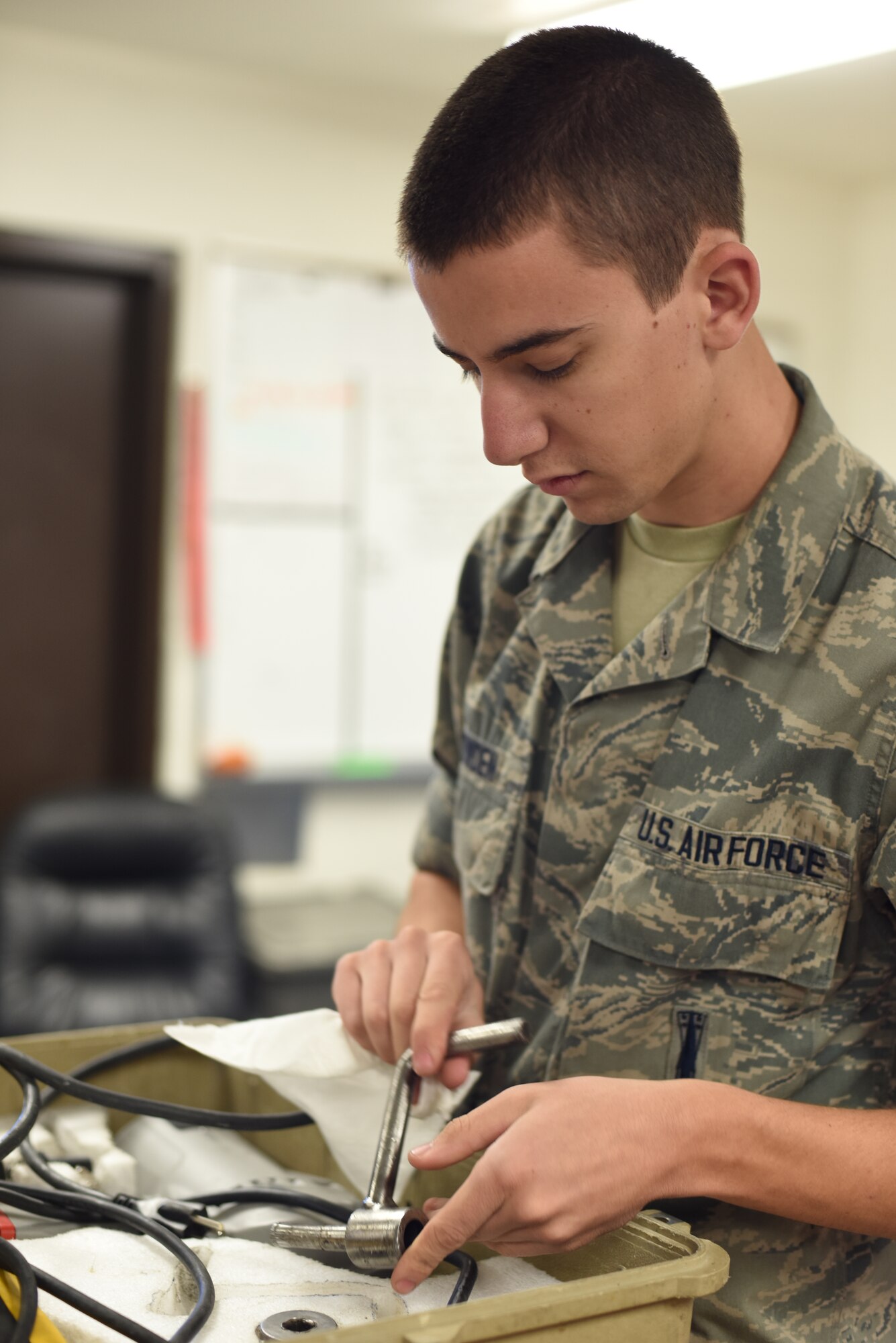 Airman 1st Class Justin Snowden, 341st Missile Maintenance Squadron tool technician, organizes and cleans a tool kit in support of Exercise Global Thunder Oct. 20, 2014. During the exercise, maintenance personnel reviewed their procedures while performing day-to-day operations. Global Thunder is a U.S. Strategic Command annual field training and battle staff exercise designed to exercise all mission areas with primary emphasis on nuclear command, control and communications. This field training and battle staff exercise provides training opportunities for components, task forces, units, and command posts to deter and, if necessary, defeat a military attack against the United States and to employ forces as directed by the president. (U.S. Air Force photo/Airman 1st Class Collin Schmidt)