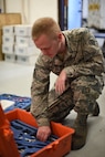 Senior Airman Charles Sikes, 341st Missile Maintenance Squadron missile maintenance team top sider, cleans and organizes a tool kit in support of Exercise Global Thunder Oct. 20, 2014. During the exercise, maintenance personnel reviewed their procedures while performing day-to-day operations. Global Thunder is a U.S. Strategic Command annual field training and battle staff exercise designed to exercise all mission areas with primary emphasis on nuclear command, control and communications. This field training and battle staff exercise provides training opportunities for components, task forces, units, and command posts to deter and, if necessary, defeat a military attack against the United States and to employ forces as directed by the president. (U.S. Air Force photo/Airman 1st Class Collin Schmidt) 