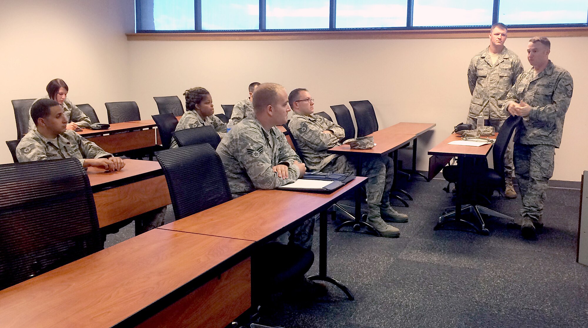 Master Sgt. Larry Carpenter and Tech. Sgt. George Maddon, 6th Air Mobility Wing public affairs, brief members from the Unit Public Affairs Representative program at the education center Oct. 29, 2014 at MacDill Air Force Base, Fla. The UPAR program allows a designated member of each unit or squadron to be the assisting eyes and ears for the MacDill public affairs office. (U.S. Air Force photo by Staff Sgt. Brittany Liddon/Released)