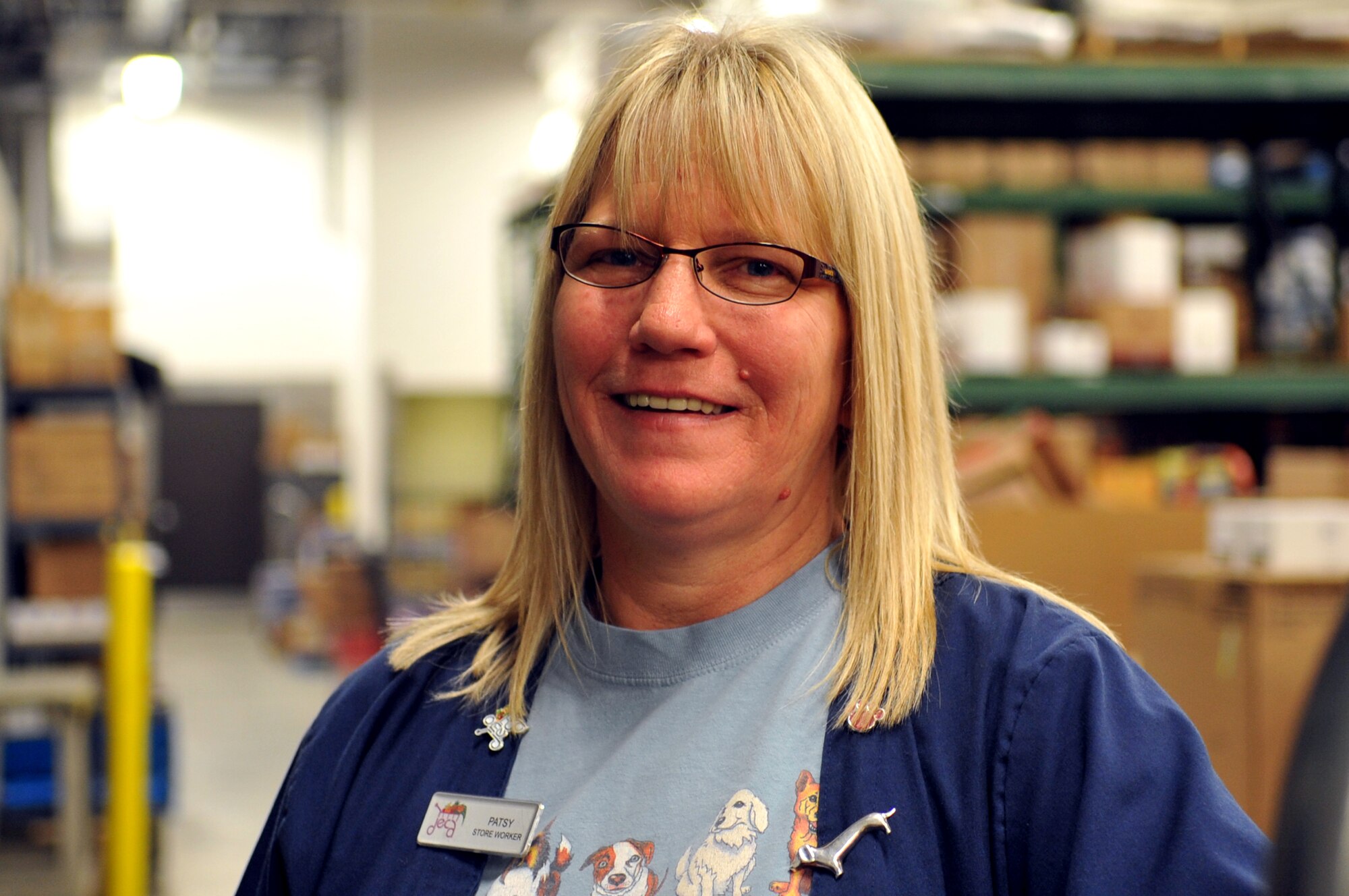 Patsy Nielsen, Grand Forks Air Force Base Commissary store worker, gathers items in the store stockroom for display on the floor here Oct. 29, 2014. Nielsen was named the Grand Forks AFB Warrior of the Week for the fifth week of October 2014. (U.S. Air Force photo/Staff Sgt. Susan L. Davis)