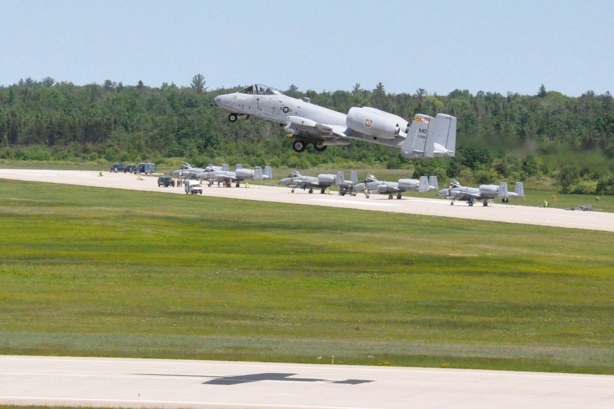 Foreground; MDANG A-10's Taking Off with Live AGM-65's Background; MIANG and INANG A-10's being loaded with Live AGM-65's