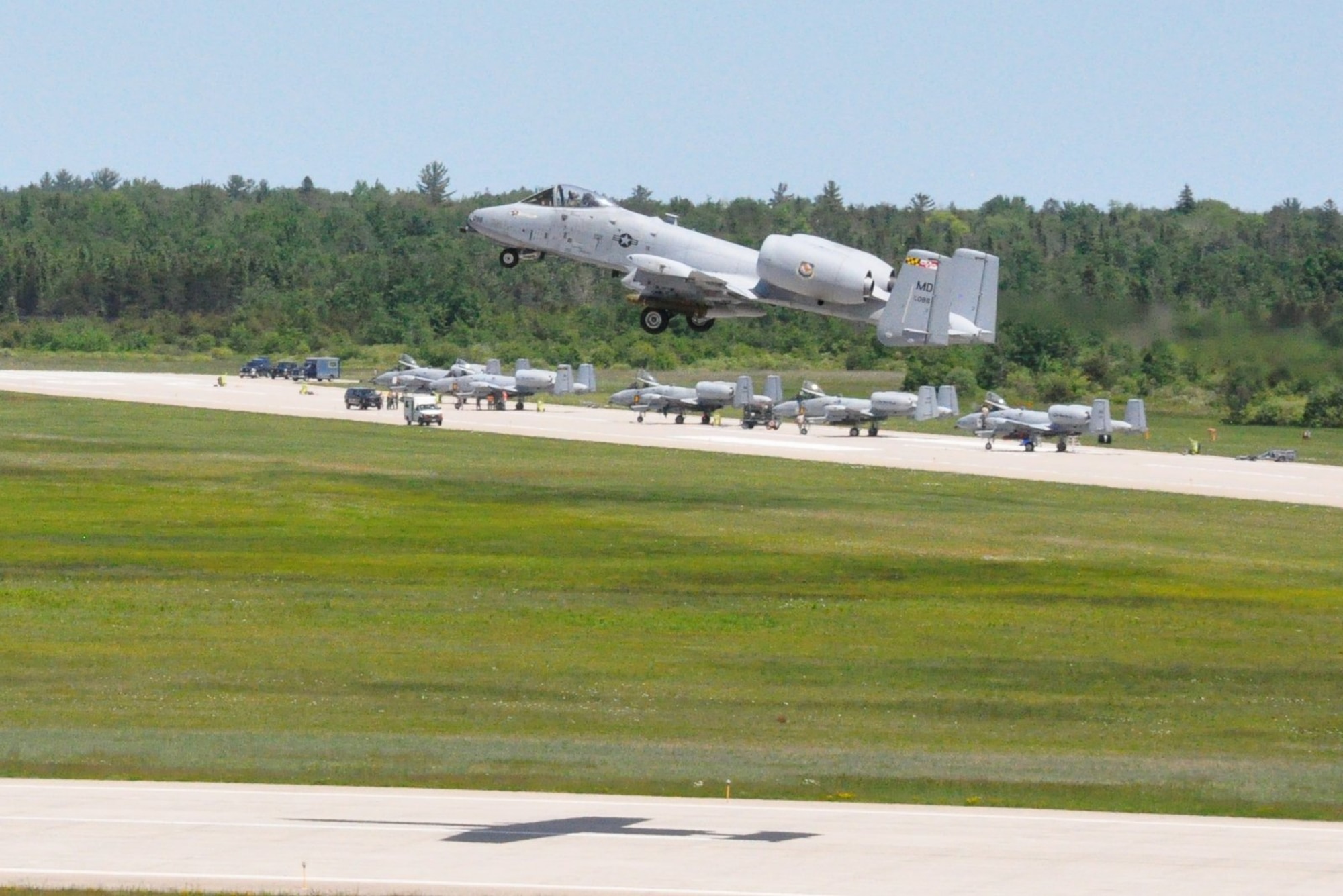 Foreground; MDANG A-10's Taking Off with Live AGM-65's Background; MIANG and 
INANG A-10's being loaded with Live AGM-65's
