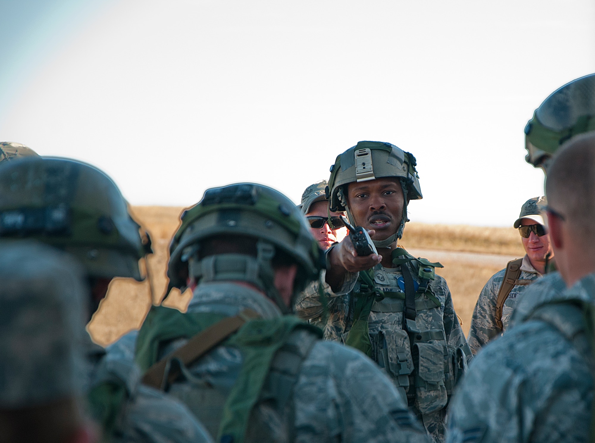 Master Sgt. Christopher Clark, 741st Missile Security Forces Squadron Convoy Response Force superintendent, briefs defenders from Malmstrom Air Force Base, Mont., after a training exercise at Camp Guernsey, Wyo., Oct. 17, 2014. Clark discussed what went right in the scenario and ways to improve. (U.S. Air Force photo by Senior Airman Jason Wiese)