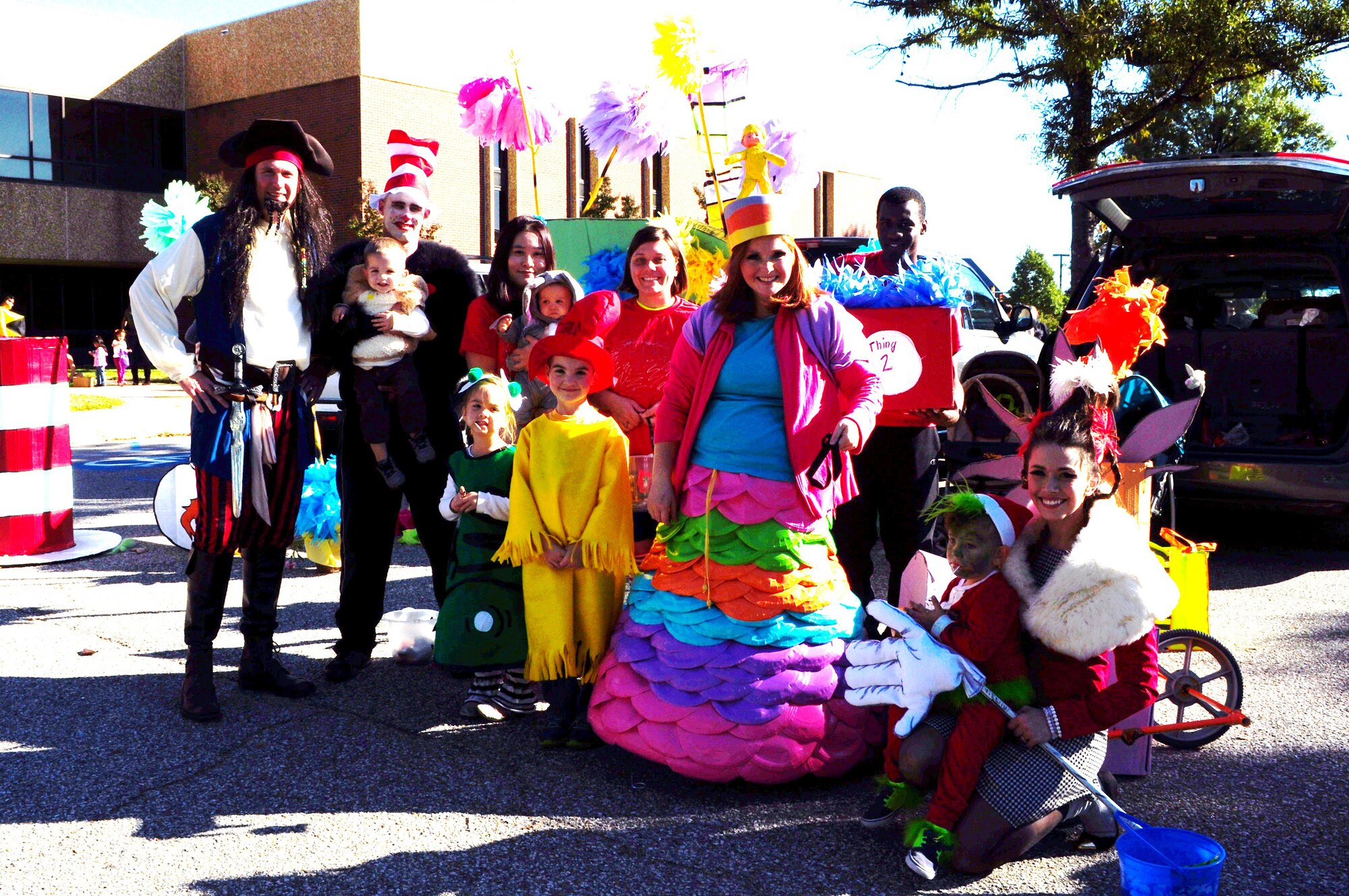 U.S. Air Force Lt. Col. Gregory Beaulieu, 633rd Force Support Squadron commander, left, congratulates members of the 15th Intelligence Squadron on winning first place in the Trunk-or-Treat costume contest at Langley Air Force Base, Va., Oct. 25, 2014. The Trunk-or-Treat event featured costume and trunk decoration contests, as well as trunks full of candy for eager trick-or-treaters. (Courtesy photo)