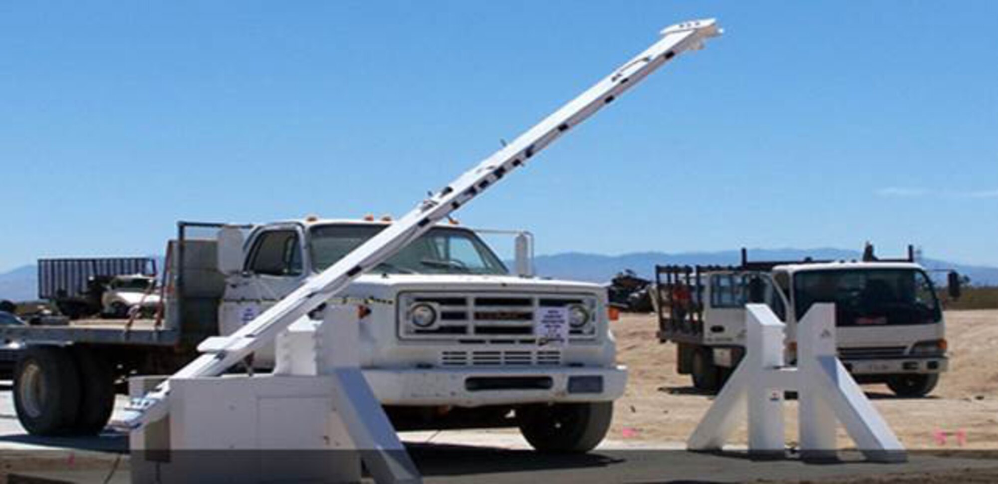 Vehicle barriers are installed at Whiteman AFB, Mo., as part of a system security upgrade. The Force Protection Division at Hanscom AFB, Mass., recently awarded the delivery order for the upgrade to ensure the safety of a nuclear weapons storage area. (Courtesy photo)
