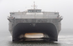 It was a foggy morning as USNS Choctaw County prepares to moor at Wharf ALPHA, Oct. 29, 2014, at Joint Base Charleston, S.C. The Choctaw County is a joint high speed vessel designed for rapid, intra-theater transport of troops and military equipment. The JHSV has a reconfigurable 20,000-square-foot mission bay area that can quickly adapt to support a number of different missions – anything from carrying containerized portable hospitals to support disaster relief to transporting tanks and troops. These ships are capable of transporting approximately 600 tons of military troops, vehicles, supplies and equipment 1,200 nautical miles at an average speed of 35 knots, and are designed to operate in austere ports and waterways, providing added flexibility to U.S. warfighters worldwide. (U.S. Air Force photo/Eric Sesit)
