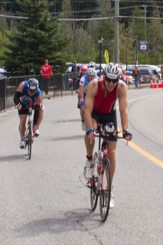 Technical Sergeant Andrew Lowe participating in the 112 mile bike portion of the North American Ironman Championship in Mont Tremblant, Quebec, Canada.