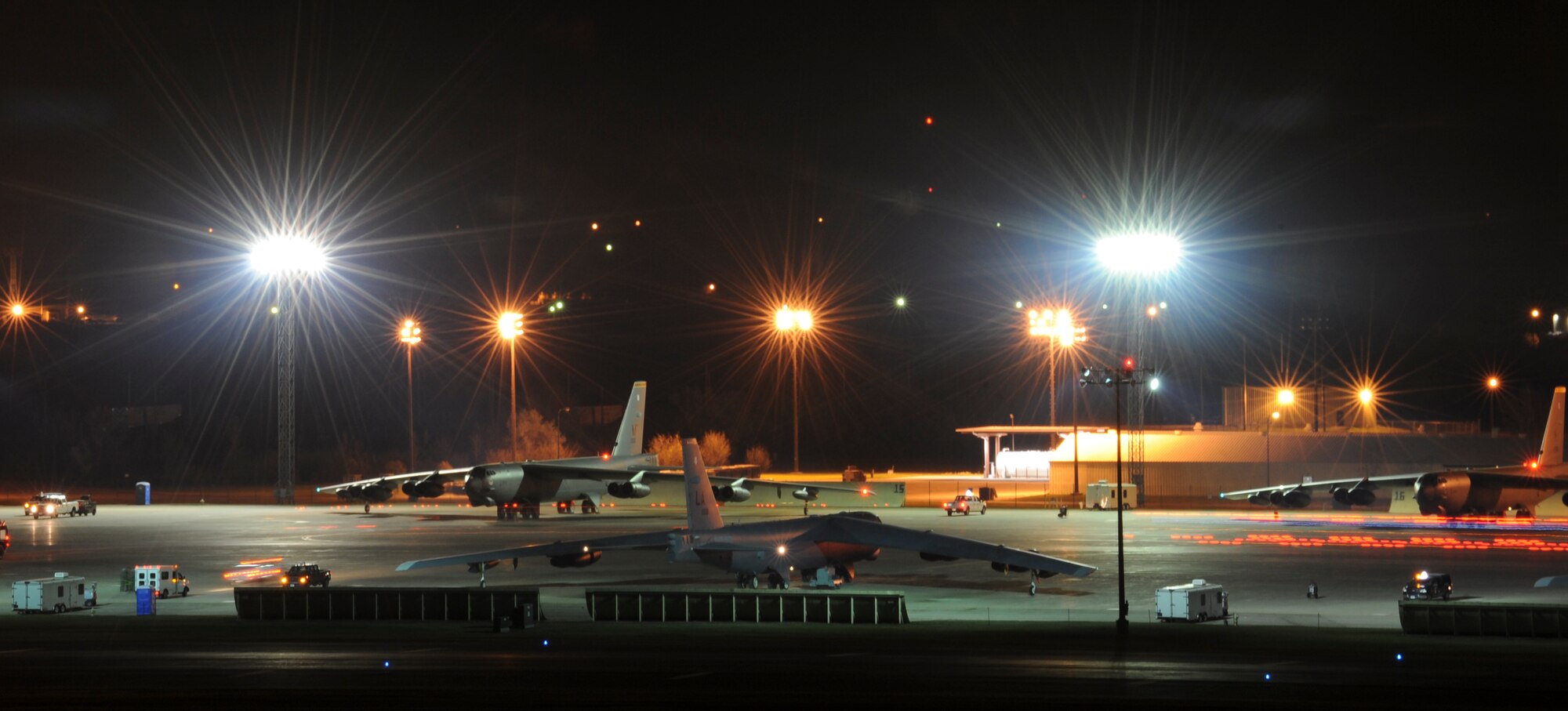 B-52H Stratofortresses wait to taxi at Minot Air Force Base, N.D., Oct. 26, 2014, during Global Thunder 15. During the exercise, a series of B-52s took off in rapid succession to test the response capabilities of the base. Global Thunder is a U.S. Strategic Command annual field training and battle staff exercise designed to exercise all mission areas with primary emphasis on nuclear command, control and communications. This field training and battle staff exercise provides training opportunities for components, task forces, units, and command posts to deter, and if necessary, defeat a military attack against the United States and to employ forces as directed by the president. (U.S. Air Force photo by Senior Airman Stephanie Morris.)

