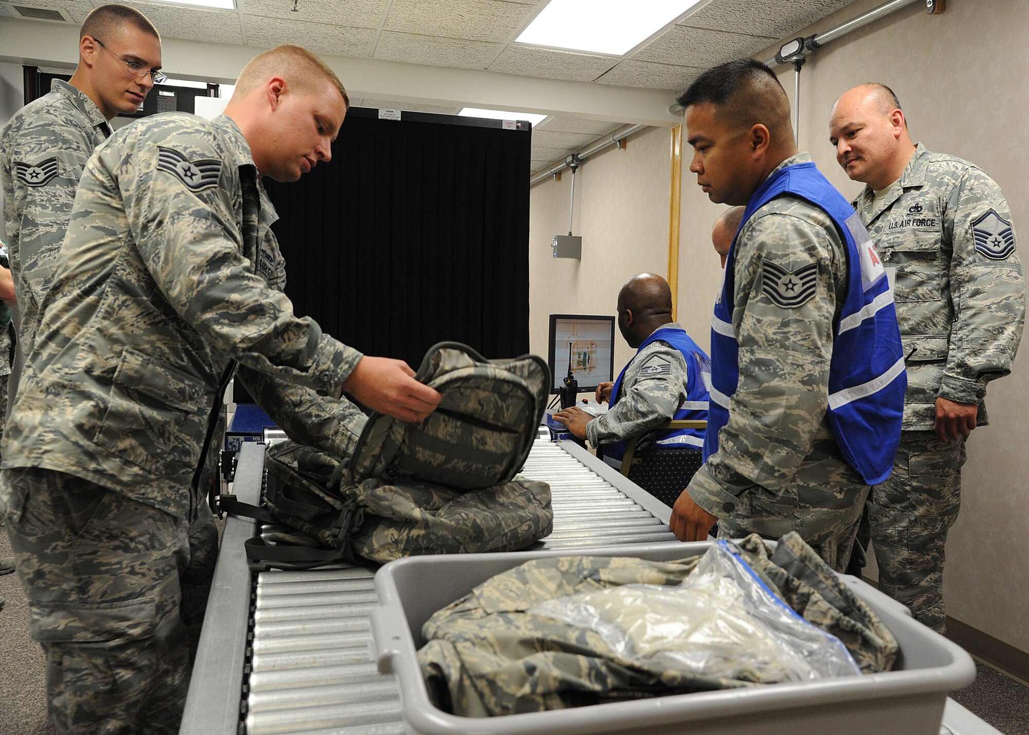 Airmen from the 2nd Logistics Readiness Squadron Air Terminal Operations check Airmen’s luggage for deployment during Global Thunder 2015 at Barksdale Air Force Base, La., Oct. 18, 2014. The exercise provided training opportunities for components, task forces, units, and command posts to deter, and if necessary, defeat a military attack against the United States and to employ forces as directed to do so. (U.S. Air Force photo/ Senior Airman Jannelle Dickey/Released)