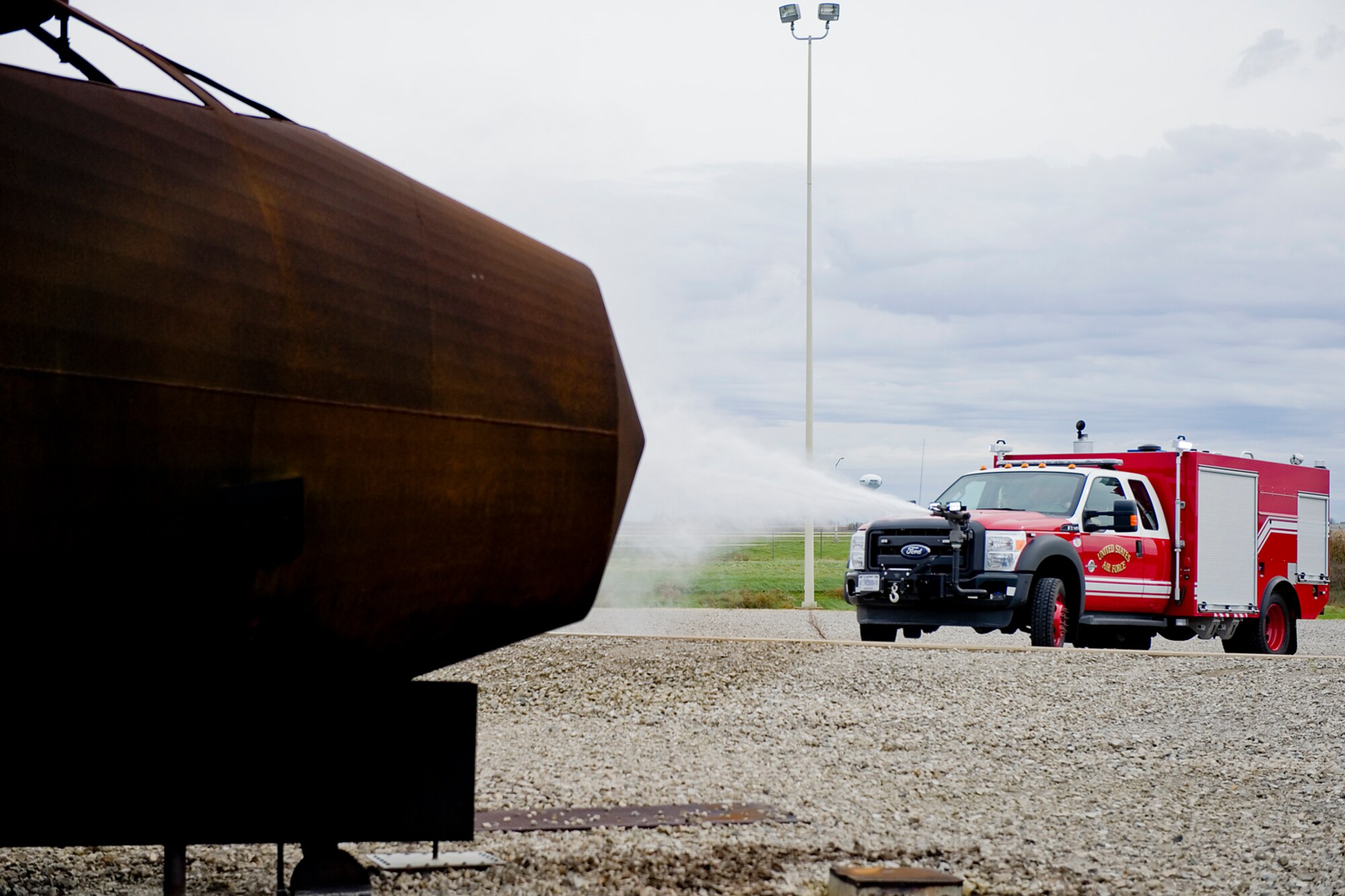 Grissom firefighters train using the new rapid intervention vehicle at Grissom Air Reserve Base, Ind., Oct. 28, 2014. The truck, dubbed a P-34, uses high pressure technology to enhance the base's firefighting capabilities. (U.S. Air Force photo/Tech. Sgt. Douglas Hays)