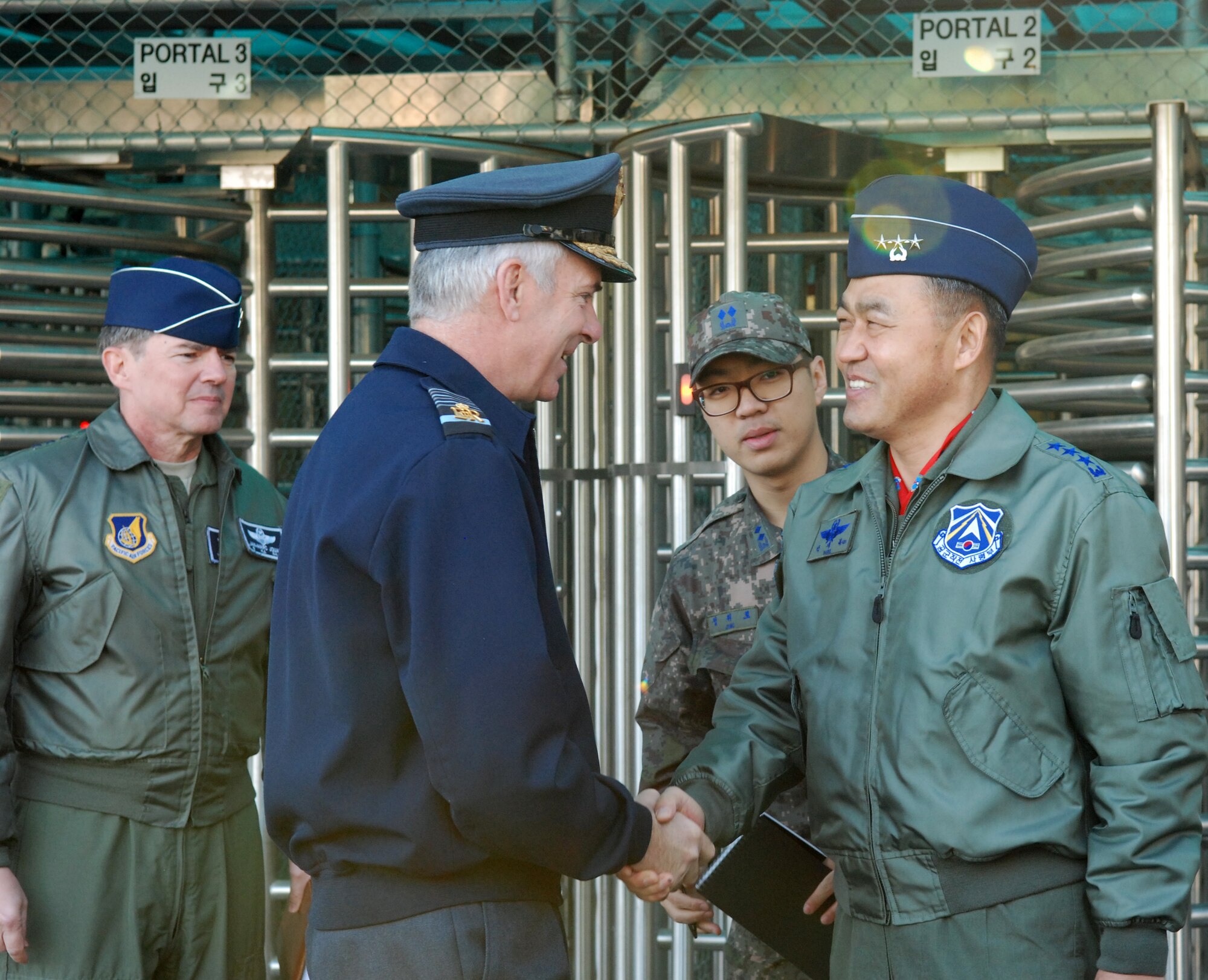 Republic of Korea Air Force Operations Command Commander Lt. Gen. Park, Jae-Bock greets Royal Air Force Air Chief Marshal Sir Andrew Pulford during his visit to Osan Air Base, Republic of Korea, Oct. 28, 2014.  Pulford also met with 7th Air Force Commander Lt. Gen. Jan-Marc Jouas (far left).  Pulford serves as chief of the air staff--the professional head of the RAF.  (U.S. Air Force photo by Master Sgt. Marelise Wood) 