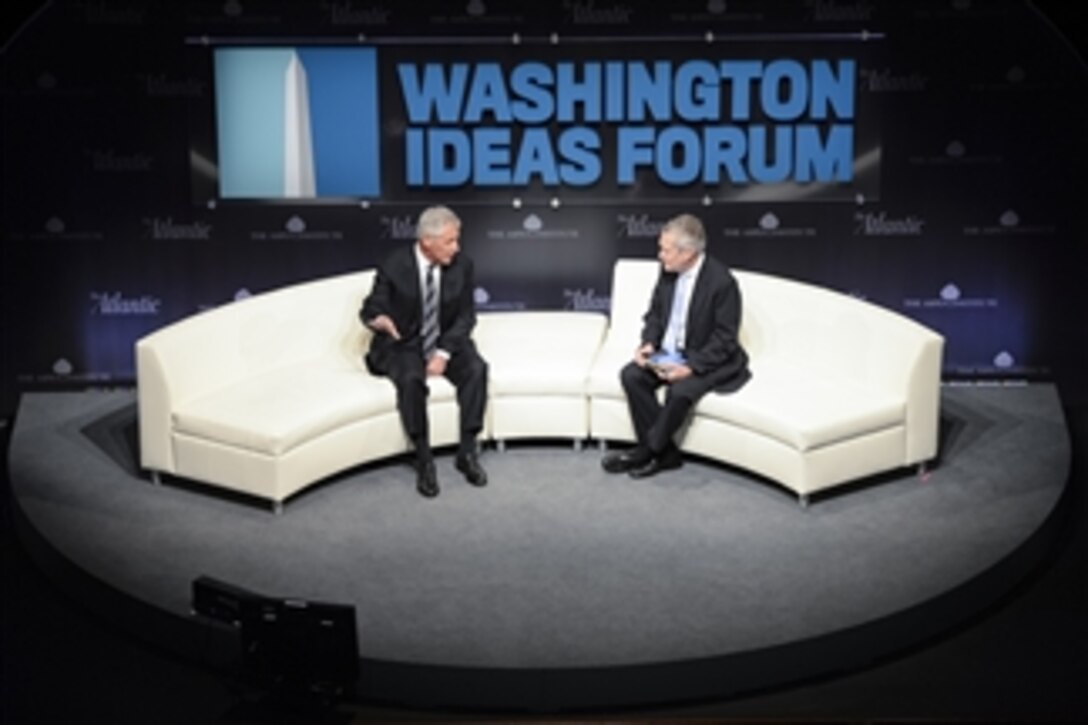 Defense Secretary Chuck Hagel, left, speaks at the Washington Ideas Forum at the Shakespeare Theater in Washington, D.C., Oct. 29, 2014. Hagel delivered remarks about the state of the Defense Department and 21st century strategies.
