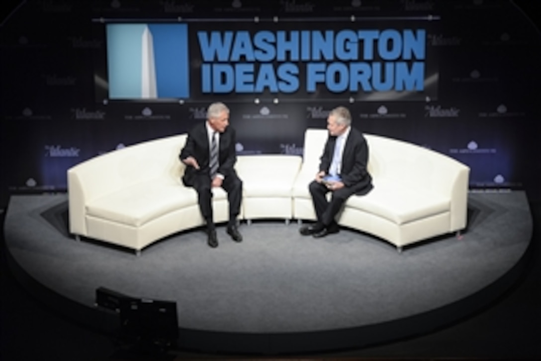 Defense Secretary Chuck Hagel, left, speaks at the Washington Ideas Forum at the Shakespeare Theater in Washington, D.C., Oct. 29, 2014. Hagel delivered remarks about the state of the Defense Department and 21st century strategies. 