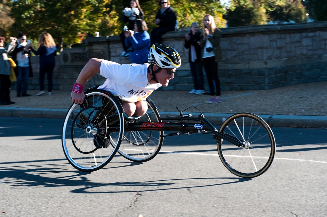Civilians and members of the U.S. Armed Forces participate in the 39th Annual Marine Corps Marathon in Washington, D.C., Oct. 28, 2014. Known as "The People's Marathon," the 26.2 mile race, rated the third largest marathon in the United States, drew 30,000 participants. (U.S. Marine Corps photos by Lance. Cpl. Nathaniel S. McAllister/Released)