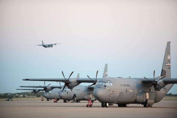 A C-130J Super Hercules departs from Dyess Air Force Base, Texas, Oct. 29, 2014. More than 35 Airmen and two C-130Js from the 317th Airlift Group and 7th Bomb Wing deployed to an air base in Western Europe, where they will provide tactical airlift support for Operation United Assistance. (U.S. Air Force photo by Airman 1st Class Kedesha Pennant)