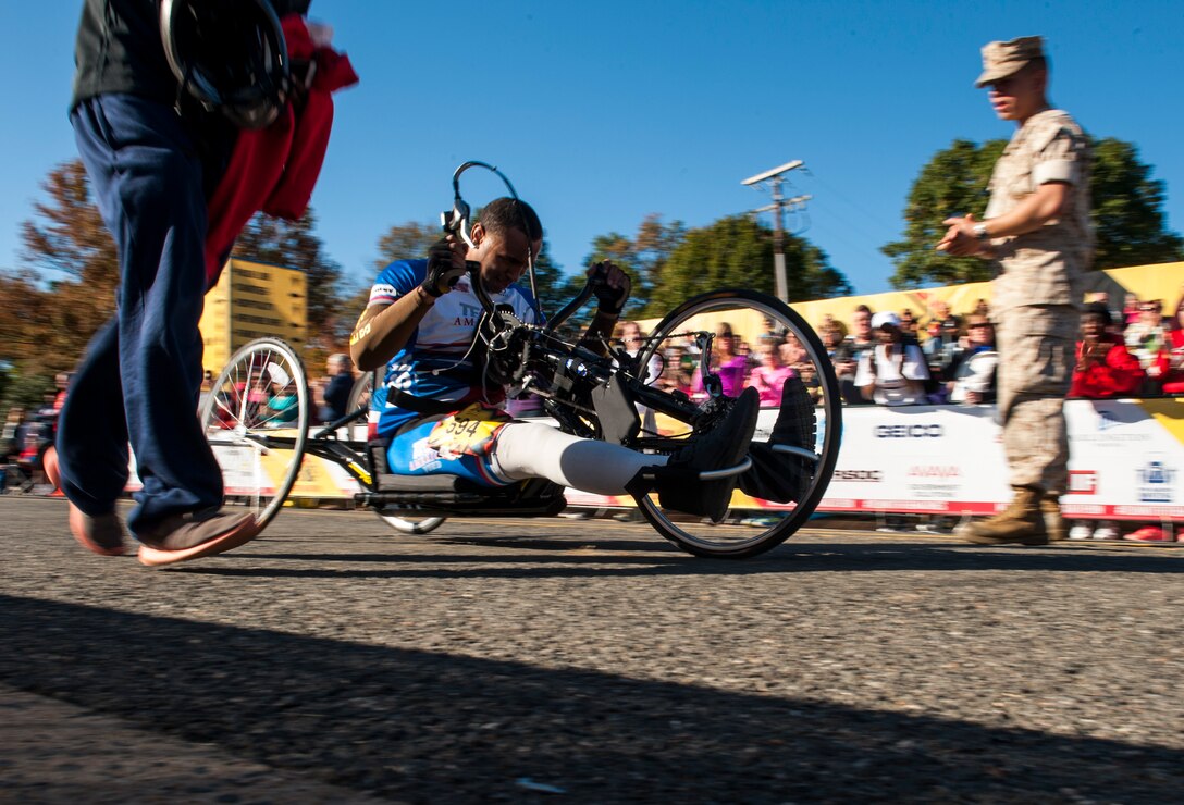 Civilians and members of the U.S. Armed Forces participate in the 39th Annual Marine Corps Marathon in Washington, D.C., Oct. 27, 2014. Known as "The People's Marathon," the 26.2 mile race, rated the third largest marathon in the United States, drew 30,000 participants. (U.S. Marine Corps photo by Staff Sgt. Ezekiel R. Kitandwe/Released)