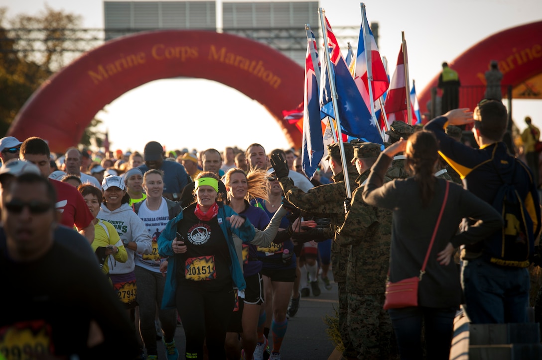 Civilians and members of the U.S. Armed Forces participate in the 39th Annual Marine Corps Marathon in Washington, D.C., Oct. 27, 2014. Known as "The People's Marathon," the 26.2 mile race, rated the third largest marathon in the United States, drew 30,000 participants. (U.S. Marine Corps photo by Staff Sgt. Ezekiel R. Kitandwe/Released)