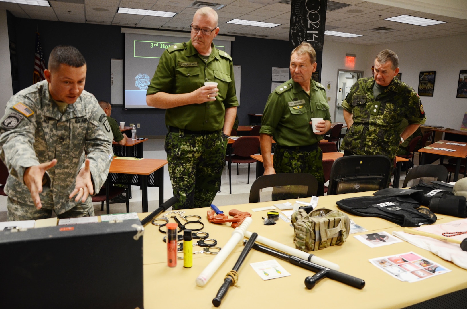 Danish military officers visit the Fort Pickett-based 183rd Regiment, Regional Training Institute Oct. 3, 2014, as part of a Department of Defense Reserve Officer Foreign Exchange, held Oct. 1-7, in cooperation with the Virginia National Guard. The visitors received a capabilities brief from each of the three battalions in the regiment, toured the RTI facility and learned about the various course offerings taught at the schoolhouse.