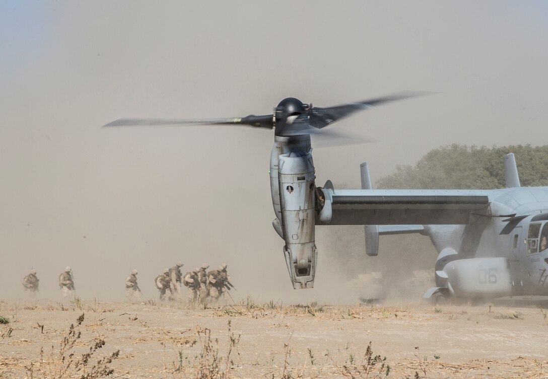 U.S. Marines with Lima Company, Battalion Landing Team 3rd Battalion, 1st Marine Regiment, 15th Marine Expeditionary Unit, load onto an MV-22B Osprey during a vertical assault raid exercise aboard Camp Pendleton, Calif., Oct. 28, 2014. BLT 3/1 is the 15th MEU’s ground combat element. (U.S. Marine Corps photo by Sgt. Emmanuel Ramos/Released)