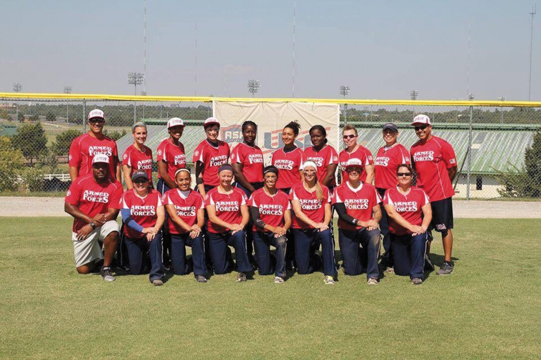 Sgt. Candice Clark (back row third left) poses with the U.S. Armed Forces Women’s Softball Team. The team competed in the 2014 Association of America Slow Pitch Women’s Open National Championship.