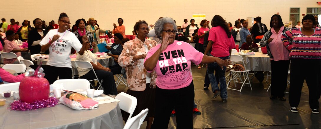 Ladies attending a Women’s Health Conference participate in a zumba exercise session at Phoebe HealthWorks, Albany, Ga., Oct. 18. The event was held to promote early detection and to celebrate breast cancer survivors.