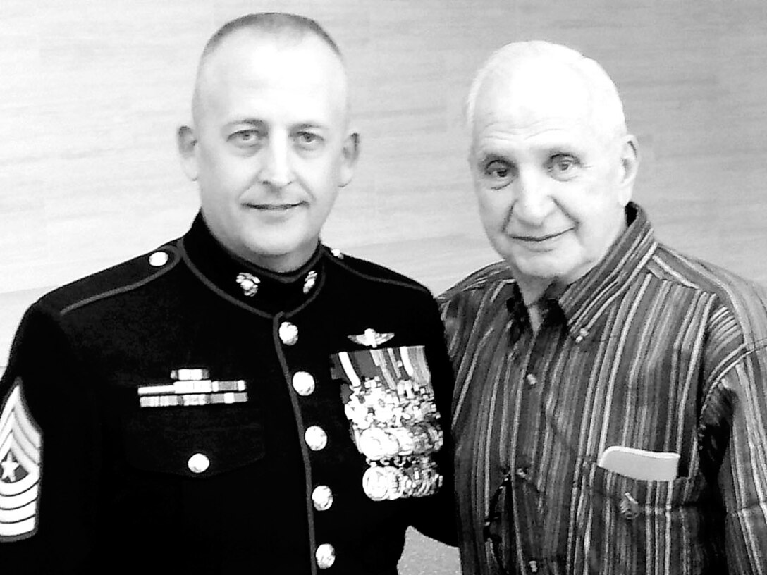 Sgt. Major Justin Lehew, sergeant major, Training and Education Command, and Marine Korean War veteran Sgt. Charles Curcio pose for a picture at the Globe and Laurel restaurant on Saturday.