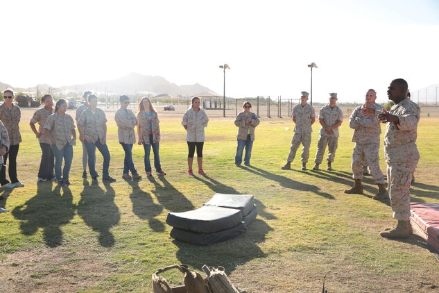 Spouses receive a demonstration on Marine Corps Martial Arts during a Jane Wayne day aboard the Combat Center, Oct. 8, 2014. The day was held for spouses of 7th Marine Regiment. (Photo by Pfc. Medina Ayala-Lo)
