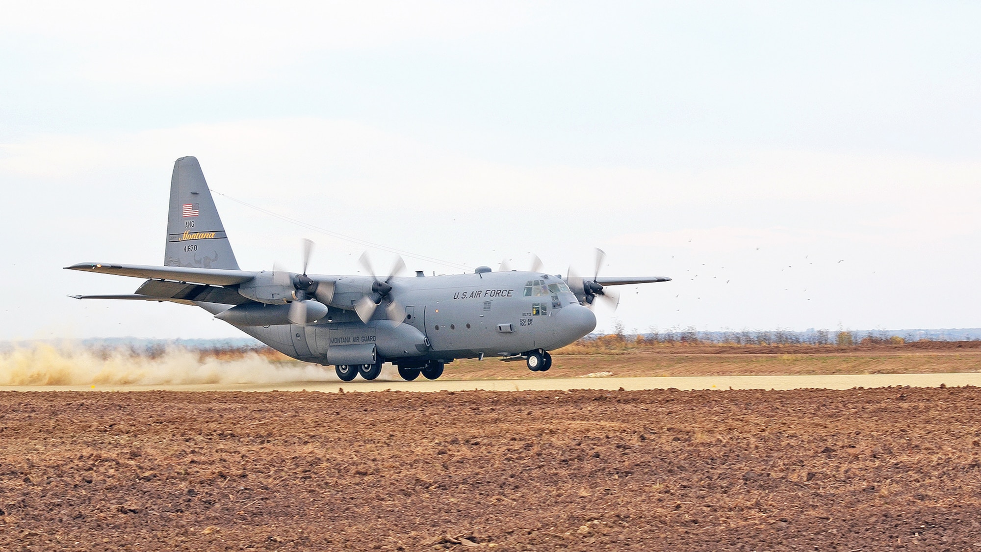 A C-130 Hercules lands on a dirt landing strip Oct. 27 at Fort Riley, Kan. The landing was part of a Joint Airborne Air Transportability Training exercise between the Army and the Air Force Oct. 27 to 29 to validate a new flight landing strip. The landing strip is one of two austere landing strips in the Army nationwide. (U.S. Army photo/Staff Sgt. Aaron P. Duncan)