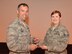Col. Karl Goerke, commander of the 932nd Airlift Wing near Belleville, presents the 932nd Airlift Wing 