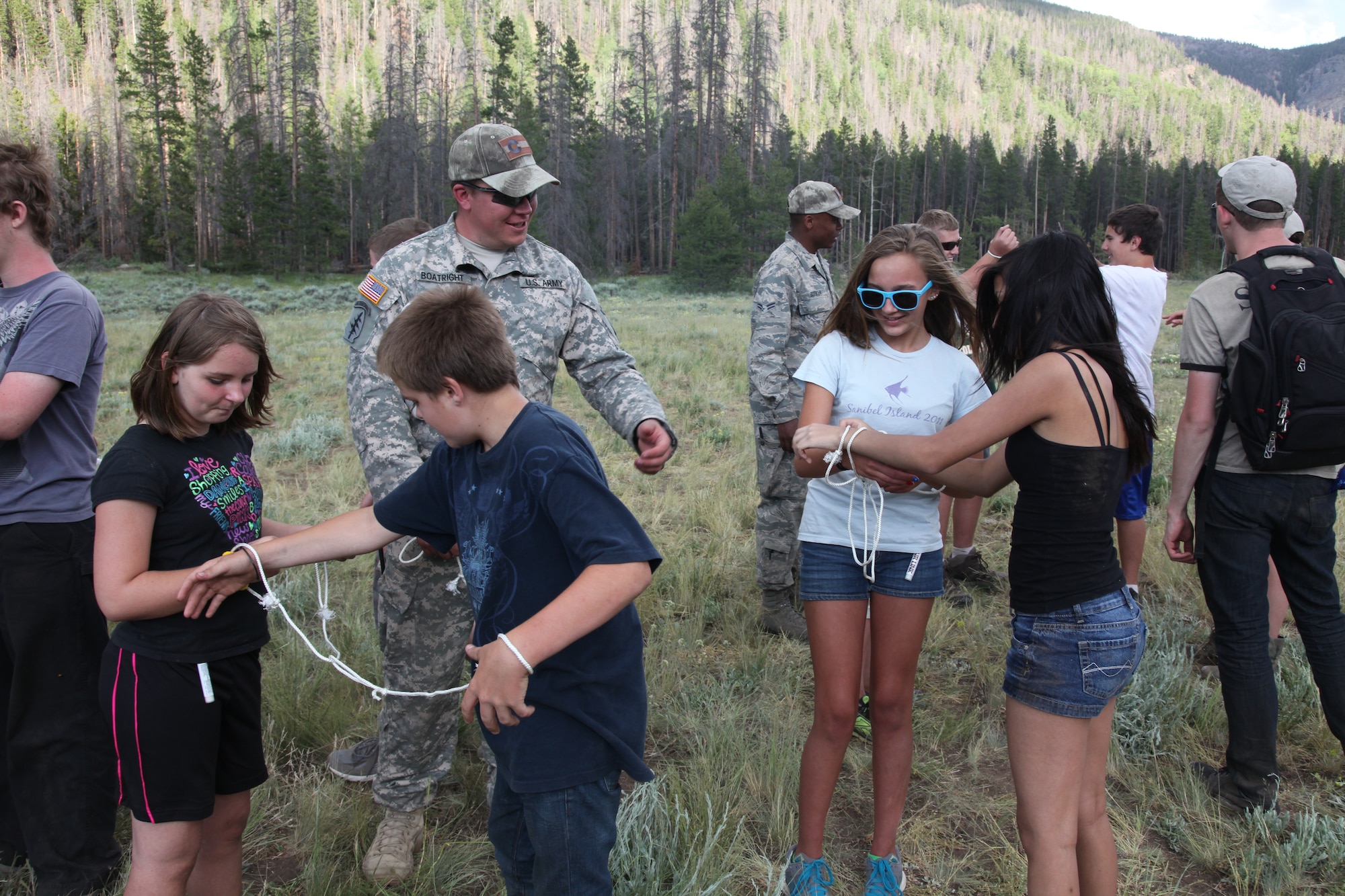 Teens participate in team building exercises during the week-long Laramie River Valley Rendezvous program near Ft. Collins, Colo. The kids, who are identified as being high-risk for potential drug use, participate in various games and activities throughout the week and are mentored by members of the Colorado National Guard. (U.S. Air National Guard Photo by Tech. Sgt. B. Kevin Coulter) 