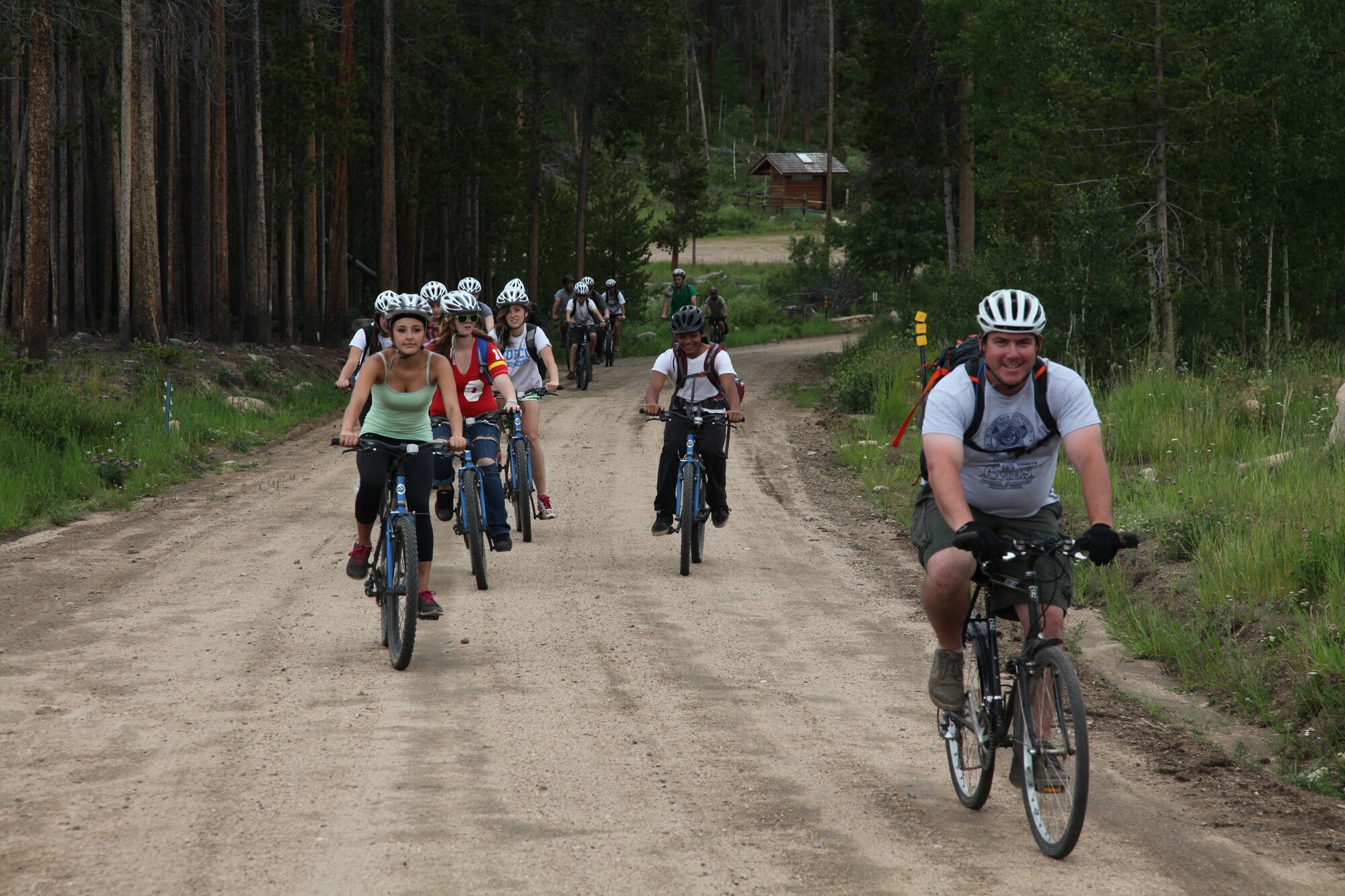 A group of teenagers mountain bike during the week-long Laramie River Valley Rendezvous program near Ft. Collins, Colo. The kids, who are identified as being high-risk for potential drug use, participate in various games and activities throughout the week and are mentored by members of the Colorado National Guard. (U.S. Air National Guard Photo by Tech. Sgt. B. Kevin Coulter) 