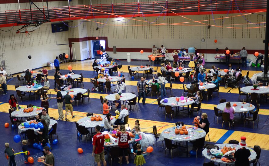 Airmen, families and friends enjoy a variety of events and activities during the Halloween Kids Carnival in the Bellamy Fitness Center at Ellsworth Air Force Base, S.D., Oct. 25, 2014. The event was designed to celebrate the Halloween season and to appreciation to Airmen and their families. (U.S. Air Force photo by Senior Airman Zachary Hada/Released)