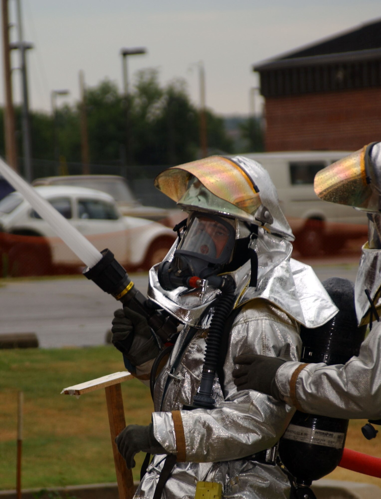 A firefighter from the 188th Wing trains during an exercise at Ebbing Air National Guard Base, Fort Smith, Ark. In addition to the 188th Fire Emergency Services Flight’s primary mission of providing fire protection to military aircraft and installation facilities, it also responded to emergency calls for commercial and civilian aircraft as well as medical emergencies through a joint-use agreement with the Fort Smith Regional Airport for 27 years. That mission ended Sept. 30, 2014. (U.S. Air National Guard photo by Tech Sgt. (Ret.) Steven Hornsey/Released)