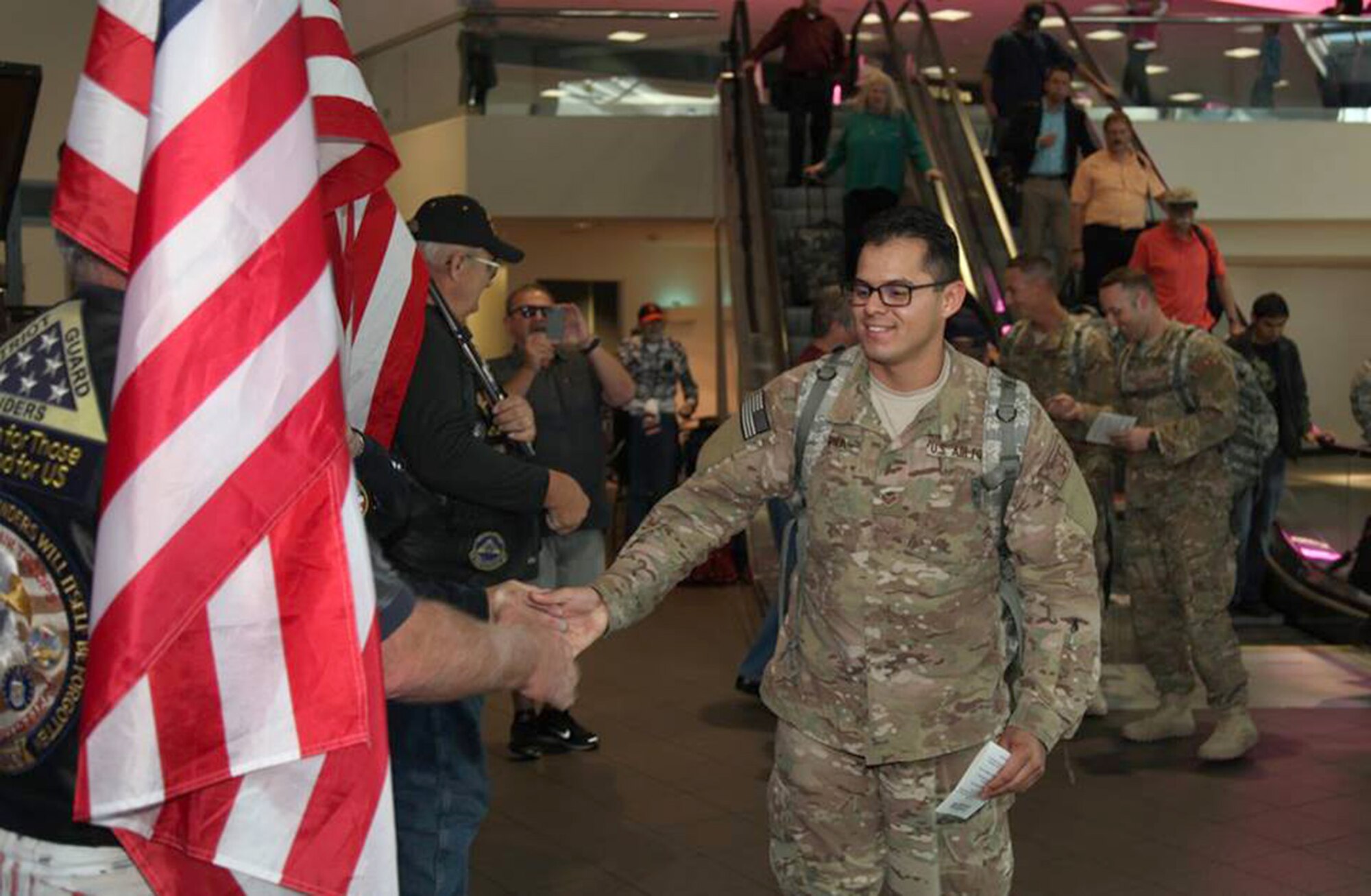 TRAVIS AIR FORCE BASE, Calif. -- Family and friends greet Defenders from the 349th Security Forces Squadron returning from Southwest Asia at Sacramento International Airport, Calif., Oct. 29, 2014. (U.S. Air Force photo/Lt. Col. Robert Couse-Baker) 
