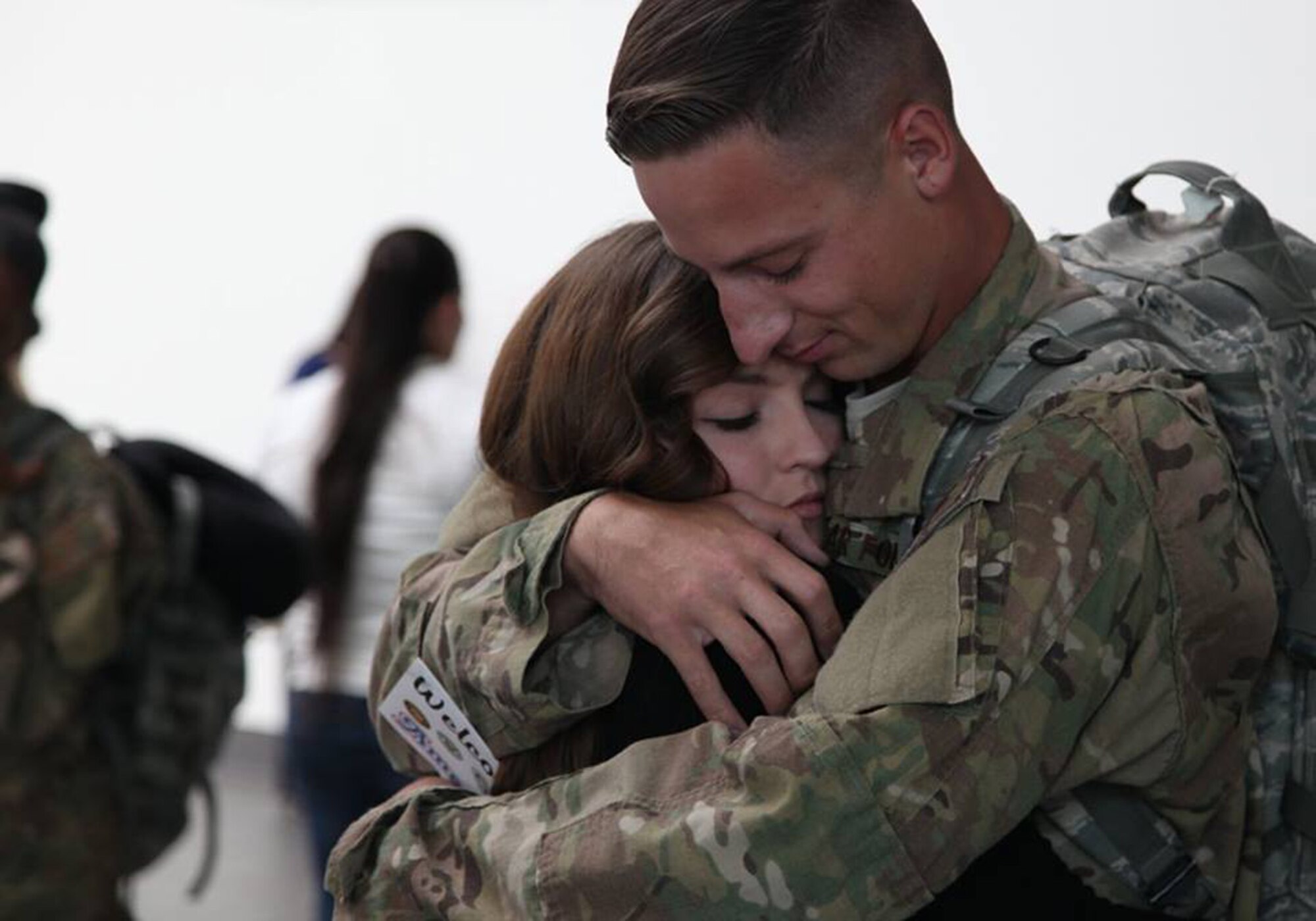 TRAVIS AIR FORCE BASE, Calif. -- Family and friends greet Defenders from the 349th Security Forces Squadron returning from Southwest Asia at Sacramento International Airport, Calif., Oct. 29, 2014. (U.S. Air Force photo/Lt. Col. Robert Couse-Baker) 