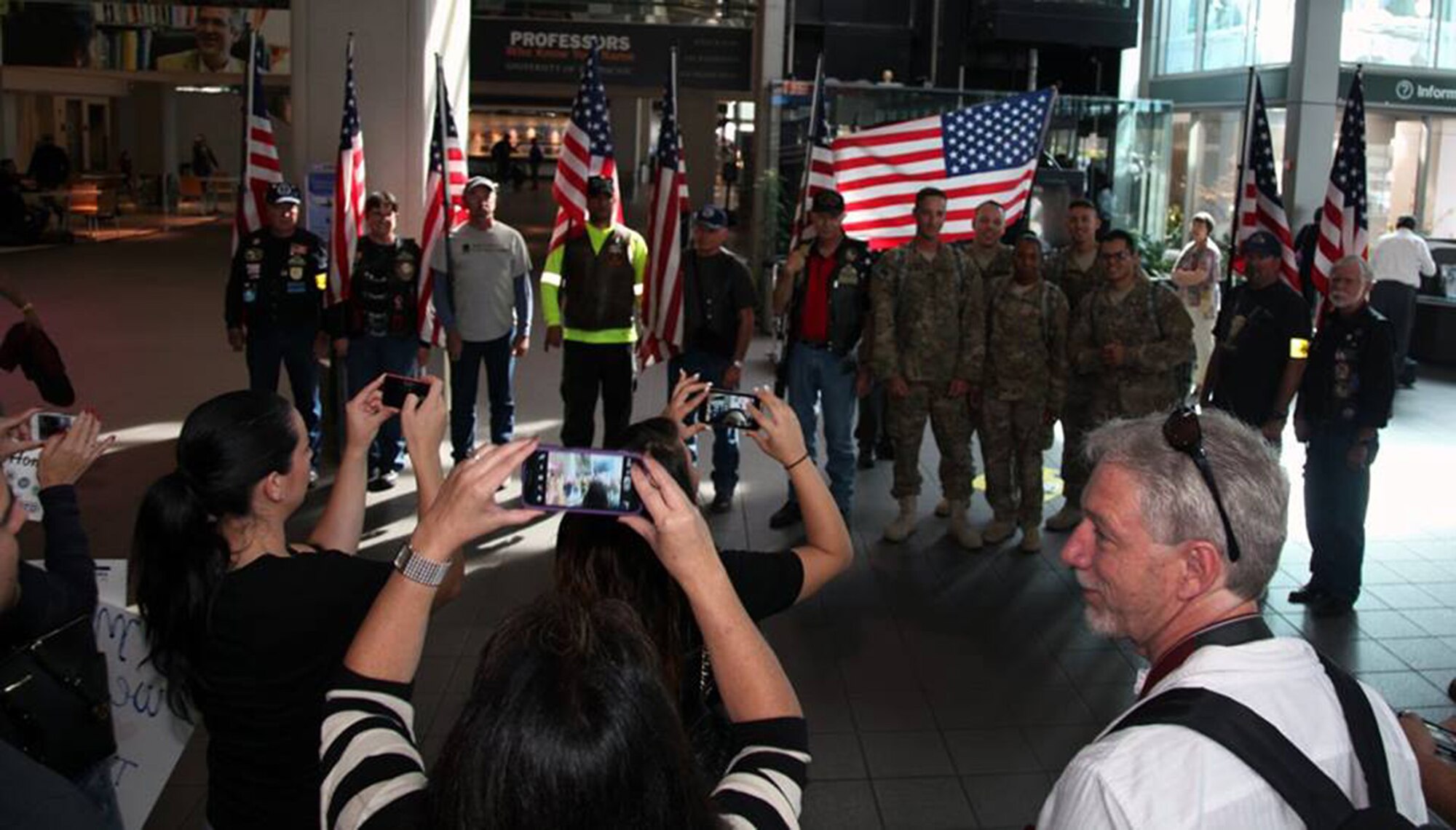TRAVIS AIR FORCE BASE, Calif. -- Family and friends greet Defenders from the 349th Security Forces Squadron returning from Southwest Asia at Sacramento International Airport, Calif., Oct. 29, 2014. (U.S. Air Force photo/Lt. Col. Robert Couse-Baker) 