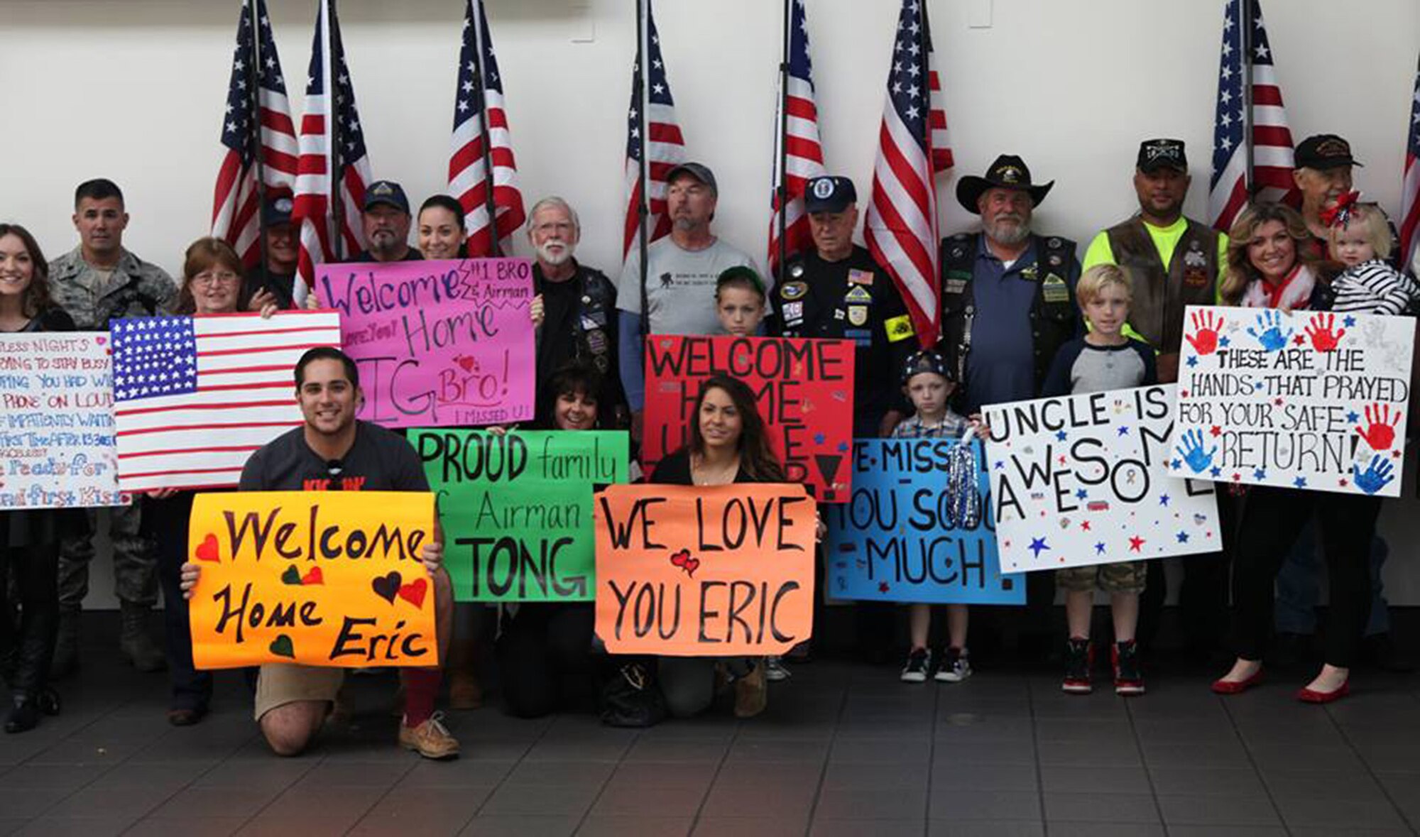 TRAVIS AIR FORCE BASE, Calif. -- Family and friends greet Defenders from the 349th Security Forces Squadron returning from Southwest Asia at Sacramento International Airport, Calif., Oct. 29, 2014. (U.S. Air Force photo/Lt. Col. Robert Couse-Baker) 