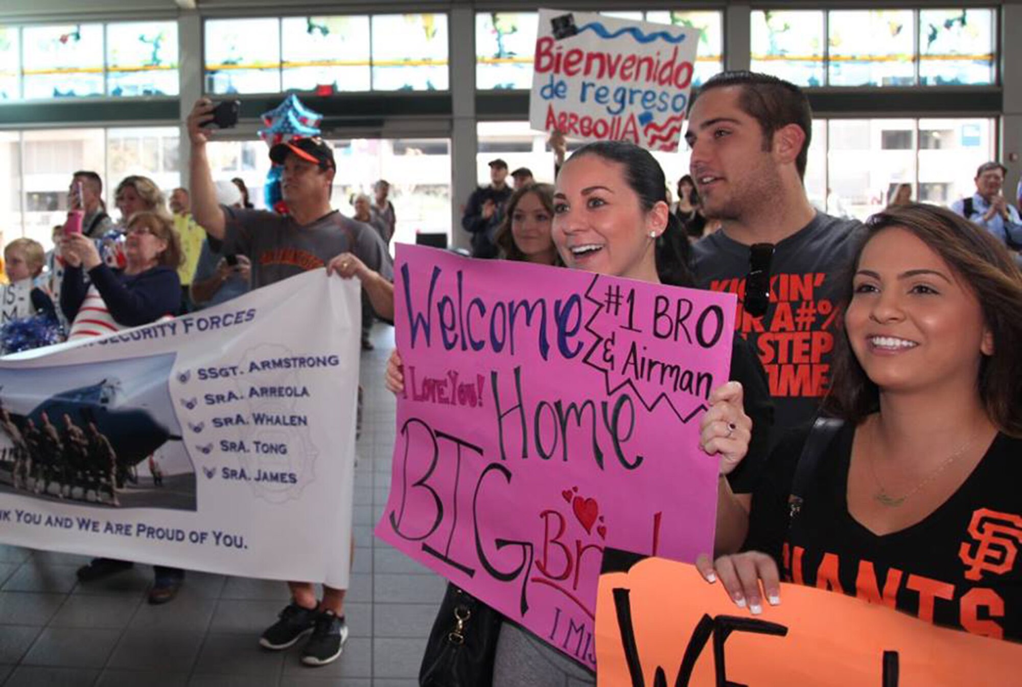 TRAVIS AIR FORCE BASE, Calif. -- Family and friends greet Defenders from the 349th Security Forces Squadron returning from Southwest Asia at Sacramento International Airport, Calif., Oct. 29, 2014. (U.S. Air Force photo/Lt. Col. Robert Couse-Baker) 