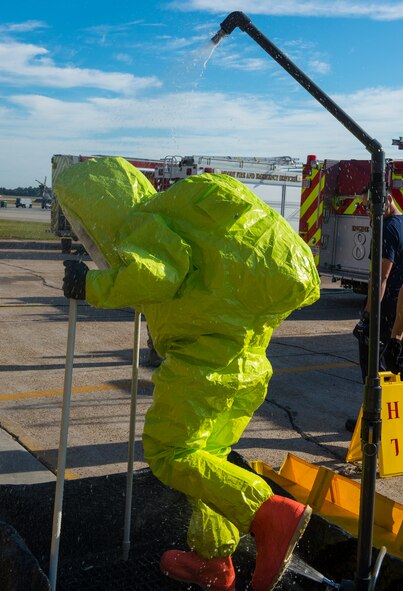 U.S. Air Force Senior Airman Benjamin Jacobson, 23d Civil Engineer Squadron operator, rinses off during hazardous material training Oct. 29, 2014 at Moody Air Force Base, Ga. Jacobson showered during the training to remove any toxins from his body that he may have been exposed to. (U.S. Air Force photo by Airman 1st Class Ceaira Tinsley/Released)