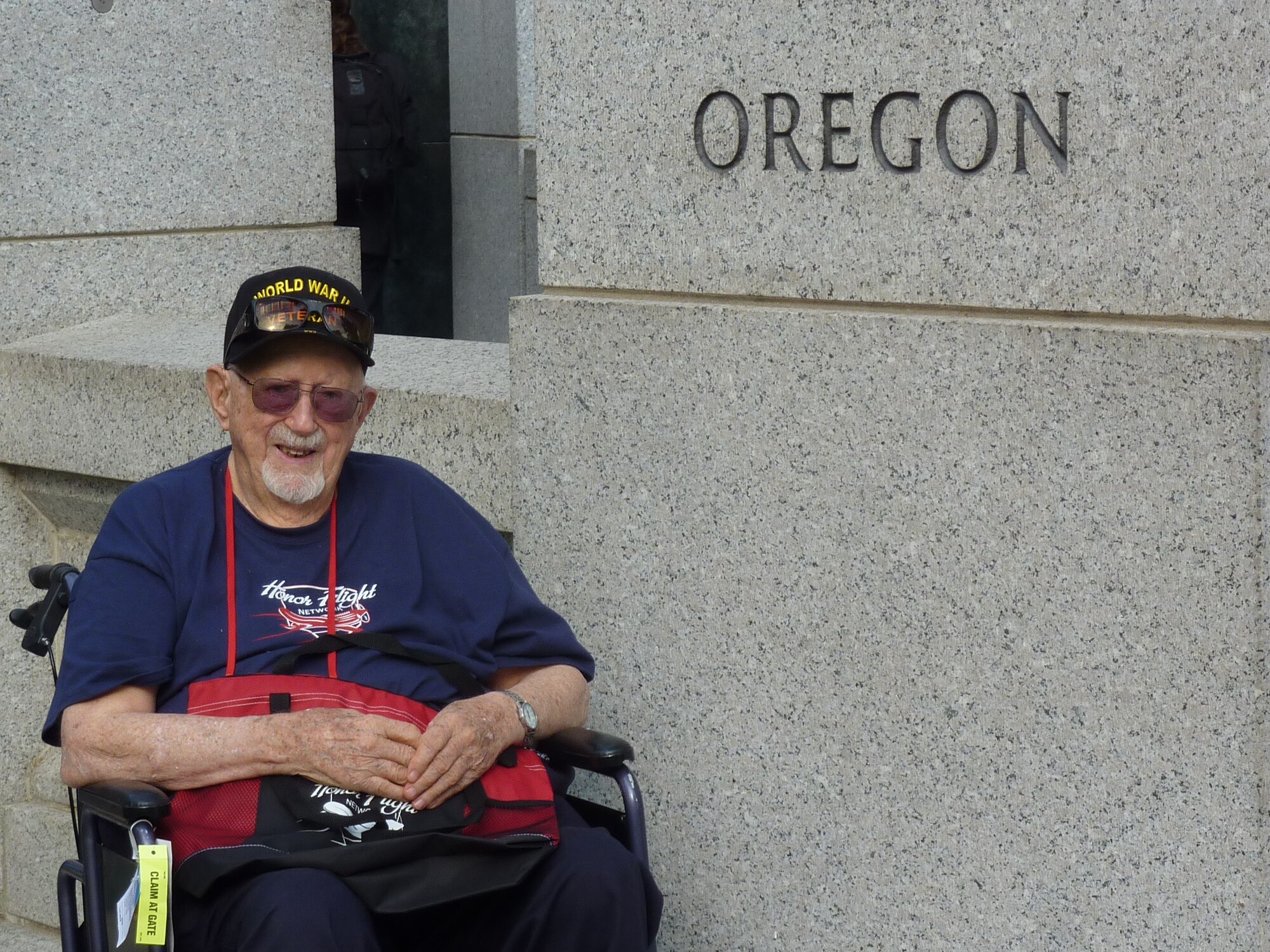 Fred Parish, of La Grande, Oregon, sits beside the granite pillar honoring Oregon and its veterans at the World War II Memorial during a recent Honor Flight trip to Washington, D.C.  Parish is a pioneering member of the Oregon National Guard’s 123rd Observation Squadron and served on active duty in the Army Air Corps during World War II.  He served as a medic both stateside and in the China-Burma-India theaters during the war, and attained the rank of Technical Sergeant.