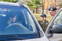 U.S. Air Force Reserve Senior Airman Justin Kelly, a 910th Security Forces Squadron member, and 11-year-old Jacob Sypert, the 910th Airlift Wing’s 60th Pilot for a Day, question Sarah (LAST NAME), a base employee, regarding a simulated traffic violation here, Oct. 29, 2014. Sypert was sworn in as an honorary second lieutenant and spent the day here experiencing military activities including a high-speed taxi down the runway in a Youngstown C-130H Hercules aircraft. The Pilot for a Day program began in 2000 as a community outreach event for the purpose of providing a fun-filled day for children with life-threatening or chronic illnesses. U.S. Air Force photo/Eric M. White