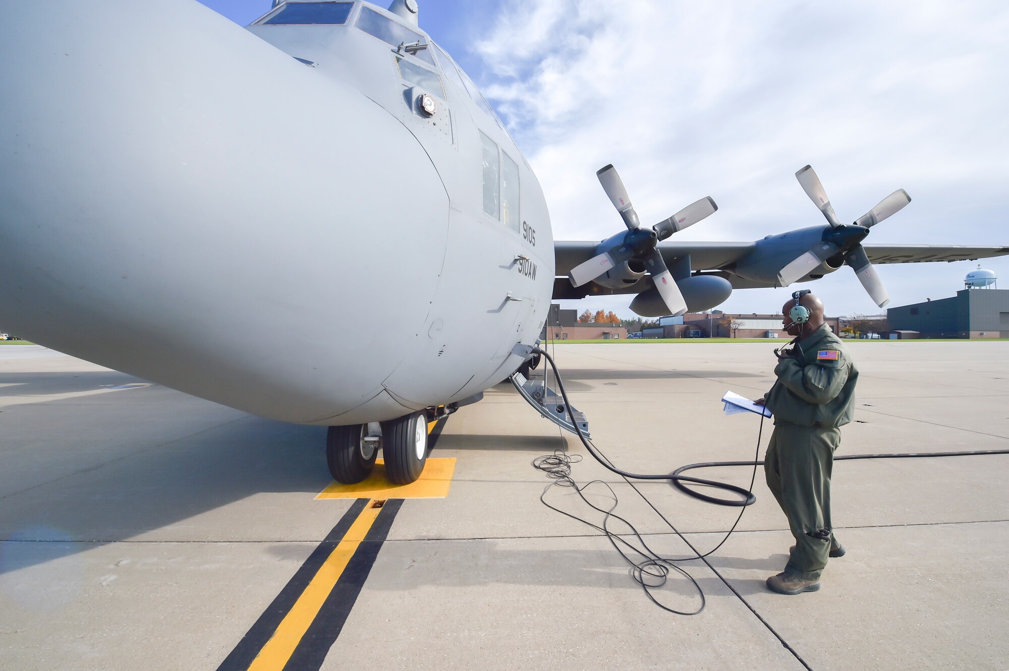U.S. Air Force Reserve Master Sgt. Lafayette Smith, Jr., a loadmaster with the 757th Airlift Squadron, works through a pre-flight checklist as part of the Pilot for a Day program here, Oct. 29, 2014. Eleven-year-old Jacob Sypert became the 910th Airlift Wing’s 60th Pilot for a Day, being sworn in as an honorary second lieutenant and spending the day here experiencing military activities including a high-speed taxi down the runway in a Youngstown C-130H Hercules aircraft. The Pilot for a Day program began in 2000 as a community outreach event for the purpose of providing a fun-filled day for children with life-threatening or chronic illnesses. U.S. Air Force photo/Eric M. White