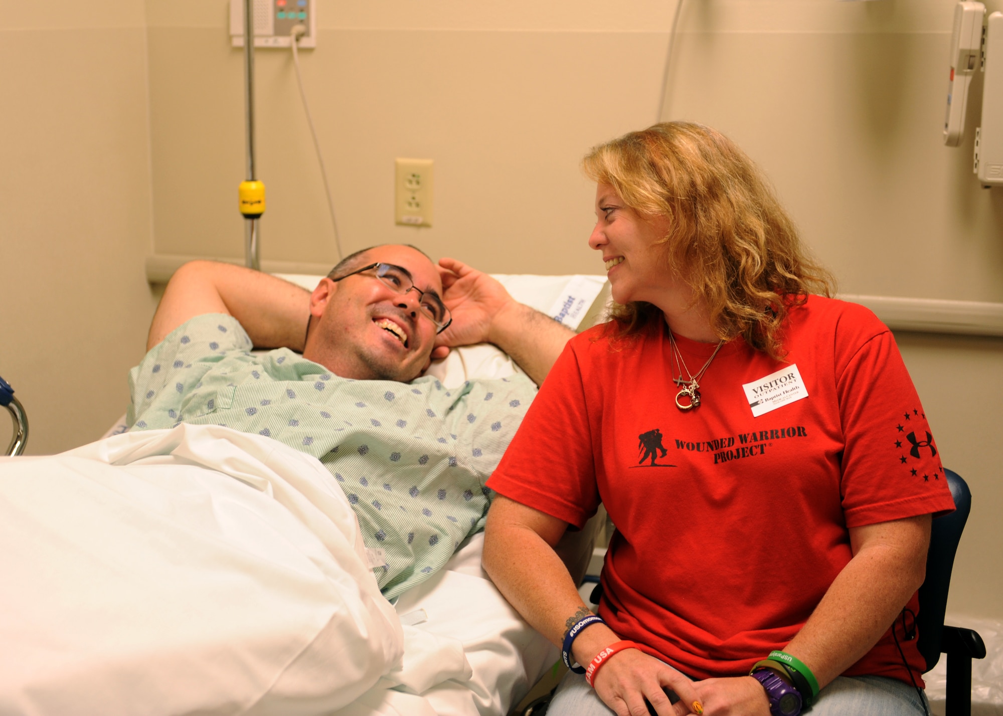 Tech. Sgt. Jason Caswell, a 19th Aircraft Maintenance Squadron crew chief, along with his wife, Tami, share a moment before he enters surgery Oct. 17, 2014, at Baptist Health Medical Center, Little Rock, Ark. Caswell injured his leg while playing rugby, and has suffered multiple complications, which  led up to his leg being amputated. (U.S. Air Force photo by Airman 1st Class Scott Poe)