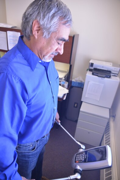 Lawrence Banegas, Civilian Health Promotion Services coordinator, demonstrates the InBody fitness scale.  The scale uses an electric current to get accurate measurements on muscle mass, body fat percentage and basal metabolic rate.  (Photo by Todd Berenger)